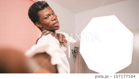Selfie of black transgender person in photo studio 107177584