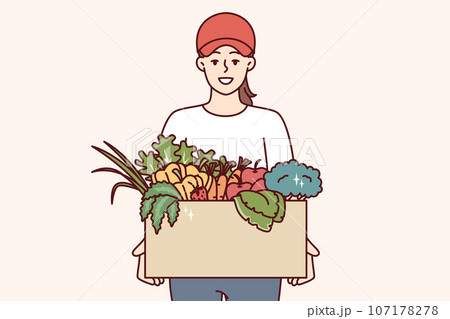 Woman farmer holds box of vegetables and fruits, offering to buy organic food at bargain price 107178278