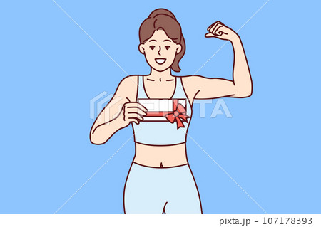 Woman holds gift certificate for fitness club and shows biceps, urging you to do sport 107178393