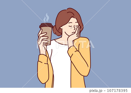 Sleepy woman holds paper cup of coffee and falls asleep standing up due to severe exhaustion Sleepy woman holds paper cup of coffee and falls asleep standing up due to severe exhaustion 107178395