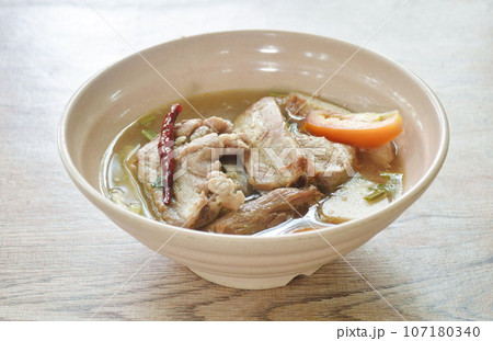 hot and spicy pork bone with tamarind and Thai herbs soup on bowl hot and spicy pork bone with tamarind and Thai herbs soup on bowl 107180340