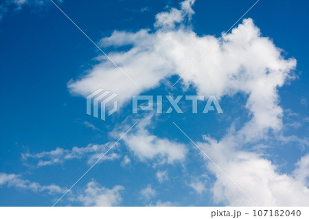 Blue sky background with cumulus clouds 107182040