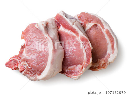 Pieces of raw meat close-up on a white background. Top view 107182079