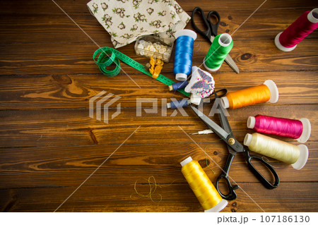 a set of tools and threads for sewing clothes a set of tools and threads for sewing clothes 107186130