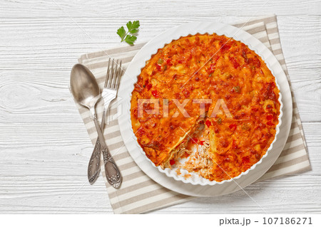 Chicken Tortilla Casserole in ceramic baking dish 107186271