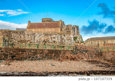 Elizabeth Castle in a low tide waters, Saint Helier, bailiwick of Jersey, Channel Islands Elizabeth Castle in a low tide waters, Saint Helier, bailiwick of Jersey, Channel Islands 107187359