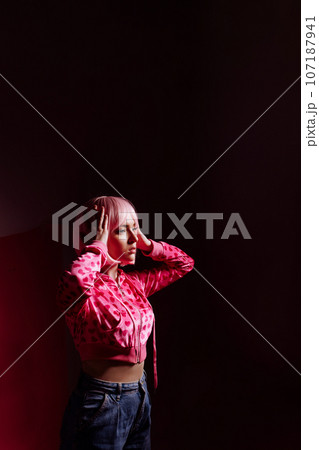 Doll woman, surreal portrait of a model with pink hair 107187941