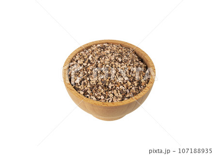 Bistorta officinalis known as bistort, common bistort, European bistort or meadow bistort in wooden bowl isolated on white background. 107188935
