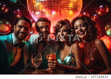 A group of friends enjoying cocktails and laughter at the bar inside discoteque, with disco ball reflections and neon lights creating a lively and retro ambiance. Generative AI 107189634