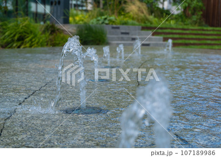 Fountain Water Texture Background, Falling Fresh Fountain Jets, Waterfall Splash Pattern, Summer Park 107189986