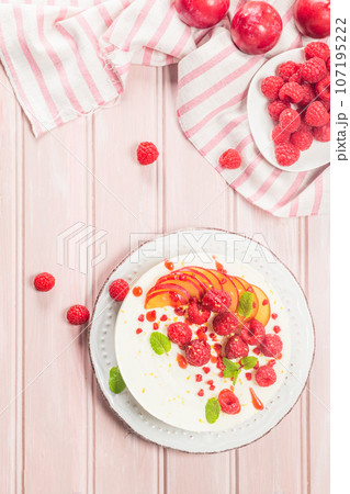 Cheesecake with fresh raspberries and plums Cheesecake with fresh raspberries and plums 107195222