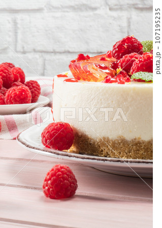 Cheesecake with fresh raspberries and plums 107195235