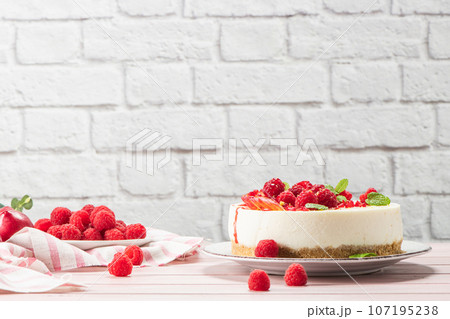 Cheesecake with fresh raspberries and plums Cheesecake with fresh raspberries and plums 107195238