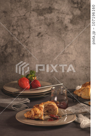 Baked croissants with strawberry jam Baked croissants with strawberry jam 107196160
