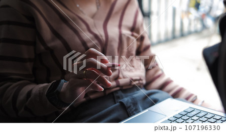 Woman taking work notes on notebook Suitable for making infographics. Woman taking work notes on notebook Suitable for making infographics. 107196330
