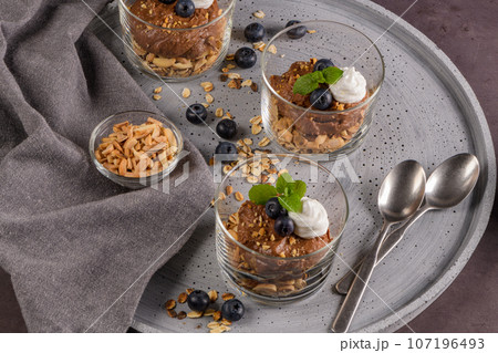 Glass cups of chocolate and chestnuts mousse 107196493