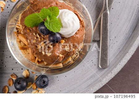 Glass cups of chocolate and chestnuts mousse 107196495