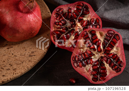 Ripe pomegranate and seeds 107196528