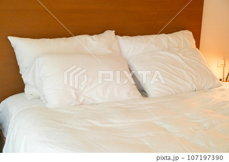 white pillow decoration on bed 107197390