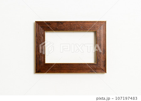 empty picture frame on white wall background 107197483