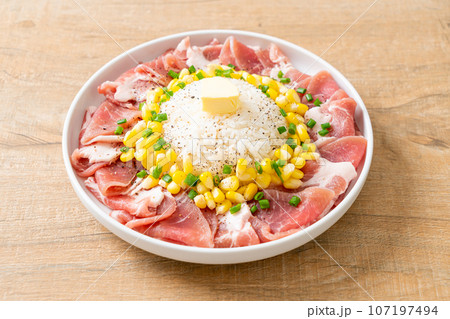 fresh pork raw sliced with rice and corn on plate and ready to cook fresh pork raw sliced with rice and corn on plate and ready to cook 107197494
