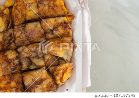 roti with egg, banana and chocolate 107197548