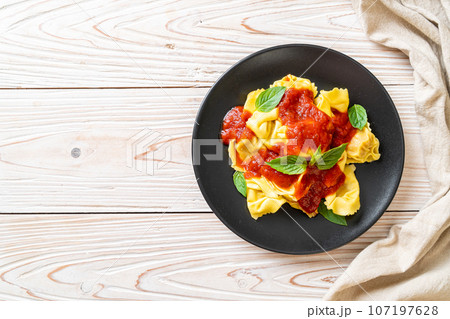 Italian tortellini pasta with tomato sauce 107197628