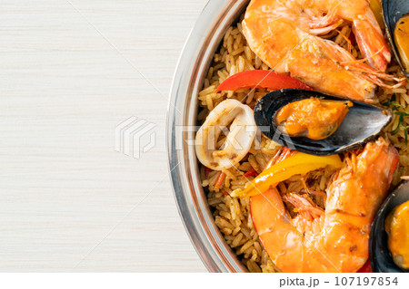Seafood Paella with prawns, clams, mussels on saffron rice Seafood Paella with prawns, clams, mussels on saffron rice 107197854