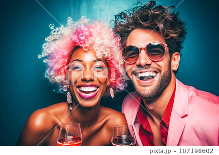 A guy and girl with bright hair smile with their teeth and look at camera. Party, public evening of popular bloggers 107198602
