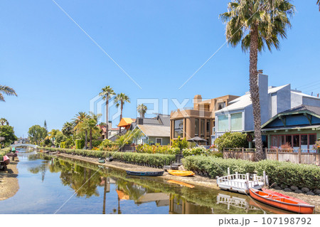 VENICE, UNITED STATES - MAY 21, 2015: Houses on the Venice Beach Canals in California VENICE, UNITED STATES - MAY 21, 2015: Houses on the Venice Beach Canals in California 107198792