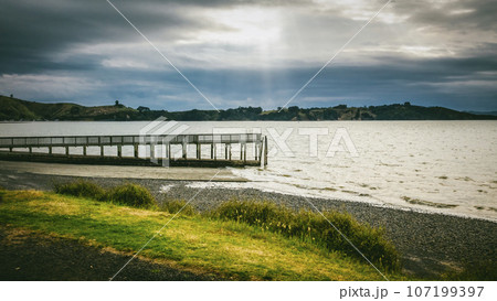 Wooden jetty of Kawakawa Bay in Manukau New Zealand Wooden jetty of Kawakawa Bay in Manukau New Zealand 107199397