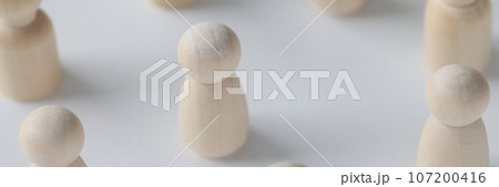 Female and male wooden figures are scattered on white background. 107200416