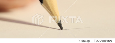 Black pencil drawing line on paper close up, shallow depth of field. Black pencil drawing line on paper close up, shallow depth of field. 107200469