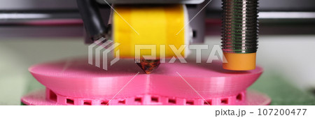 3D printer printing plastic part close up. 107200477