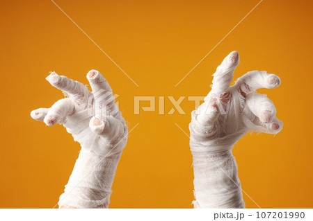 The mummy's hands are wrapped in a bandage The mummy's hands are wrapped in a bandage 107201990