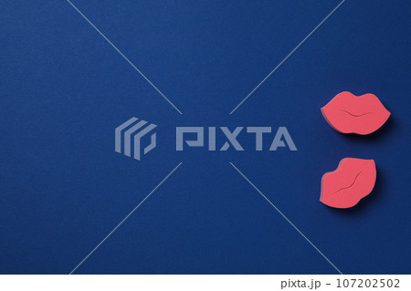 Cosmetic sponges on dark blue background, space for text 107202502