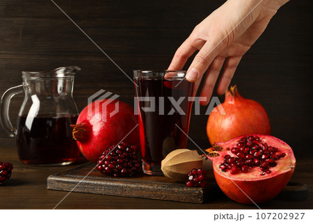 Pomegranate juice, delicious and fresh drink, tasty beverage 107202927