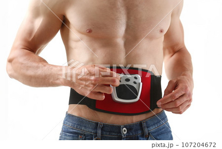 Athletic folded man uses an electric 107204672