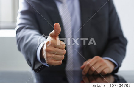Male hand showing OK or confirm sign with Male hand showing OK or confirm sign with 107204707