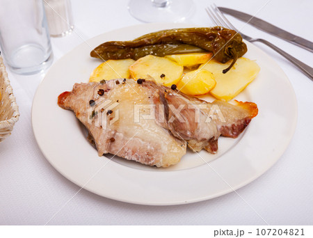 Pork steak with baked potato and pepper Pork steak with baked potato and pepper 107204821