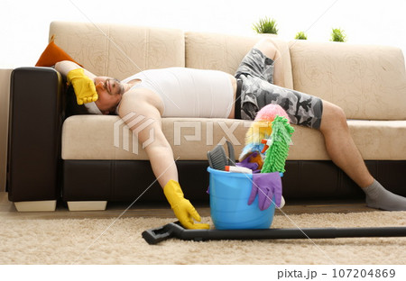 The man was left alone at home tired 107204869