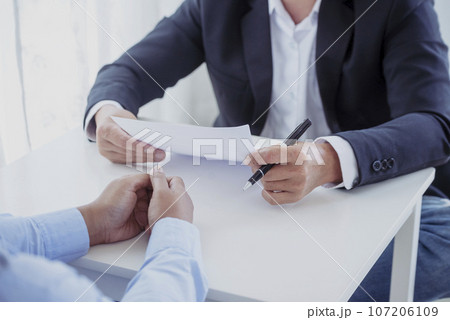 Business people job interview by HR officer shaking hands in office smiling face with happiness. Manager Businesswoman interview employee face to face sitting in meeting room. Job Interview Concept. Business people job interview by HR officer shaking hands in office smiling face with happiness. Manager Businesswoman interview employee face to face sitting in meeting room. Job Interview Concept. 107206109