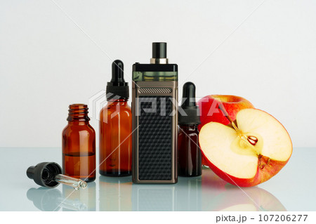 Vape liquid with apple flavor on white background Vape liquid with apple flavor on white background 107206277