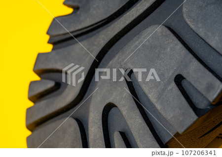 Rubber sole of a sports sneaker close up Rubber sole of a sports sneaker close up 107206341