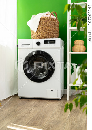 Laundry basket on washing machine in a laundry room Laundry basket on washing machine in a laundry room 107206342