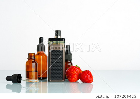 Electronic cigarette liquid with strawberry flavor on white background Electronic cigarette liquid with strawberry flavor on white background 107206425