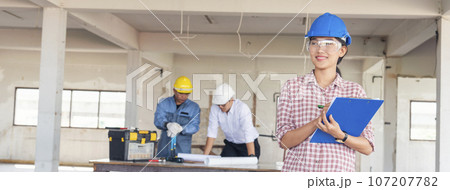Banner Civil construction engineer team meeting on construction site with partner teamwork trust team consult together. Panorama image engineer team discuss wear hard hat construction engineer concept 107207782