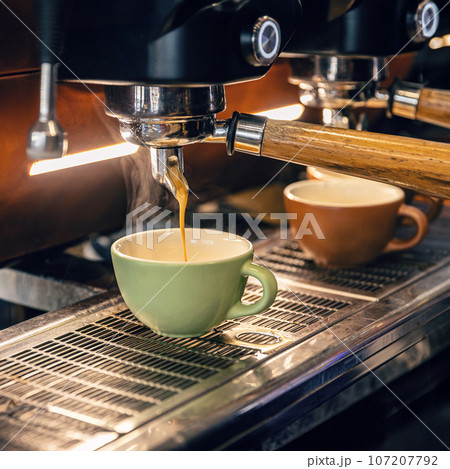 Espresso machine making fresh coffee 107207792