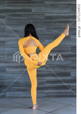 Bird of paradise or Svarga Dvijasana yoga with ukrainian woman making it indoors Bird of paradise or Svarga Dvijasana yoga with ukrainian woman making it indoors 107214952