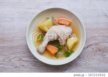 boiled chicken leg with potato and carrot couple onion soup on plate 107215810